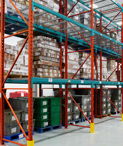 An image of our warehouse, with stacks of bins and packages on metal shelves